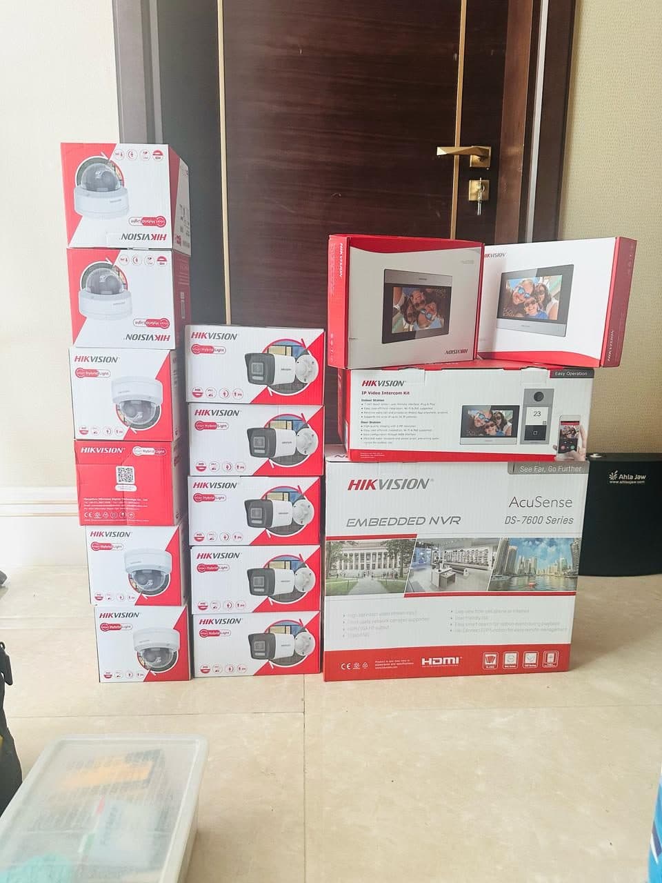 CCTV cameras, an embedded NVR and a video intercom kit staged and ready ahead of a full security installation.