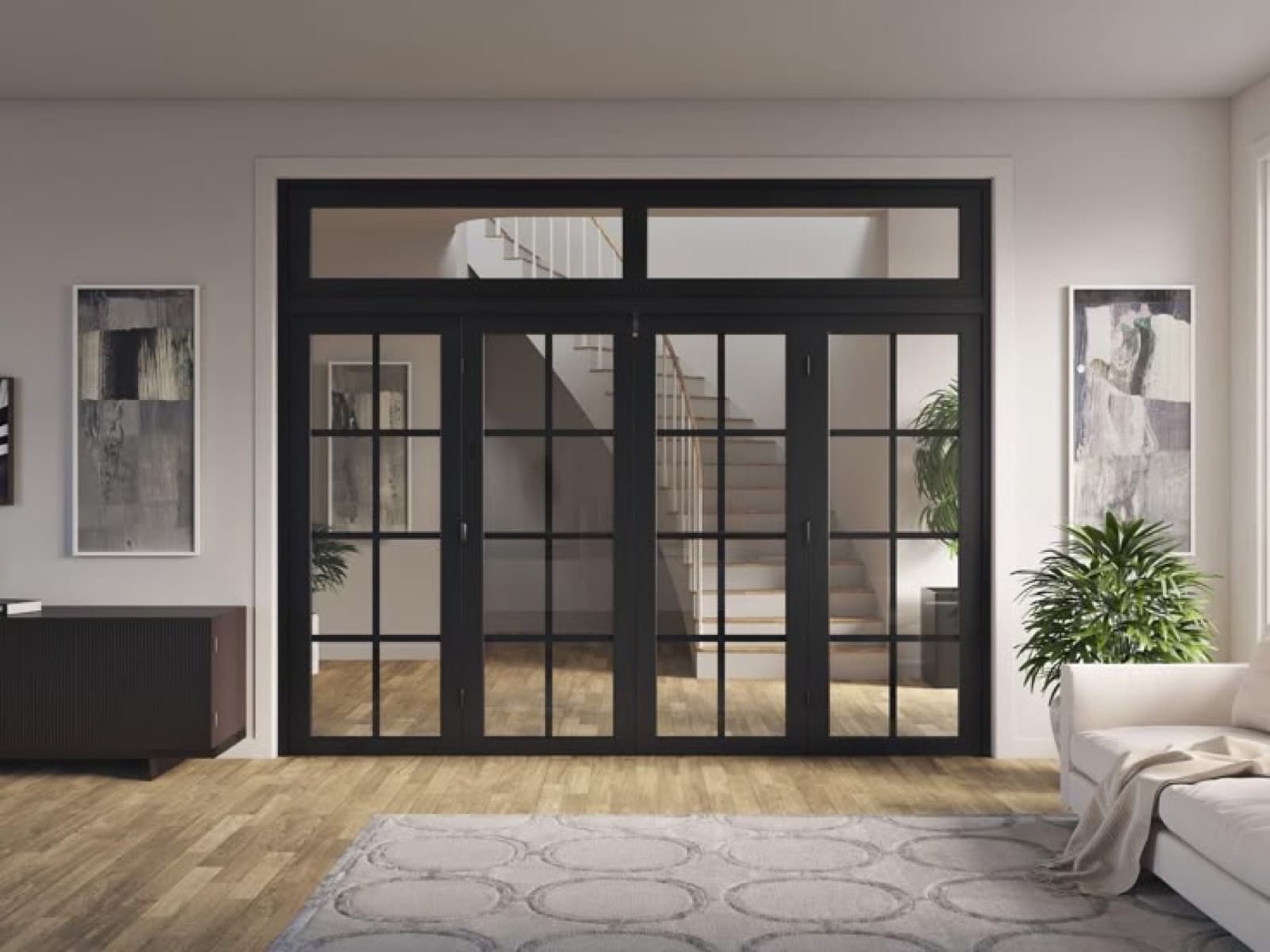 Black-framed aluminum glass folding doors opening onto a staircase and living area