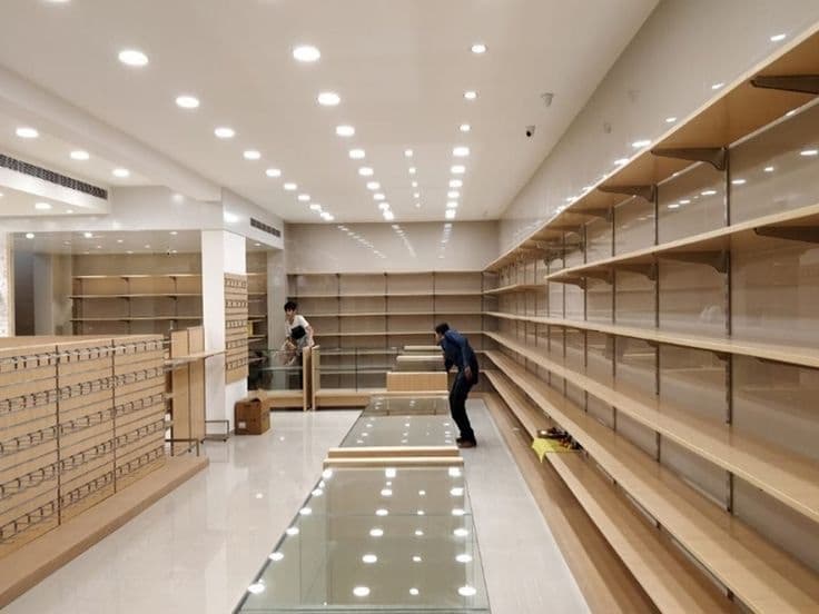 Retail shop interior with custom-built display shelving during fit-out